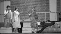 (from left to right) - Terry Shellnut (Paul), Madde Stager (Rosalind) and Wendy Ludgewait (Charlotte Hay) scramble to bring a drunk Freddy McDaniel (George Hay) to his wits so he can go on stage to do his scenes.  -  Photos by Jamie Morehart