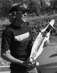 Back where it all started:  Smith displays one of his vintage boards, a '70s-era Turner slalom board, made by the late boardshaper Bob Turner, who died this summer of a heart attack.  Smith recently sold one of his old boards to a collector at a race in California for $400. / Photo by Missy Votel