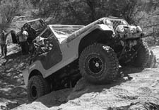 Jacque and John Foutz of Farmington, attempt to overcome an "obstacle" on the Alien Trail at Avalanche Ranch.  "I'm not having fun anymore," said Jacque (with a smile) as the Jeep went almost vertical.