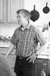 Ken Bigelow stands in the kitchen of the SkyRidge home he shares with his family.  Bigelow worked for a year on his house, using sweat equity to help finance it through a Colorado Housing Inc. program. /Photo by Todd Newcomer