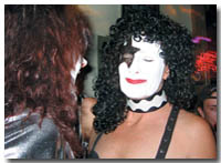 Paul Stanley and Ace Frehley swap makeup tips at Steamworks.