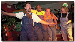 Members of Durango DOT Comedy, from left, Mark Brown, Dre Louis and Tim Zink, act our a scene dictated by the crowd Monday night at Scoot 'n Blues while fellow member Sarah St. John tries to decipher the puzzle.