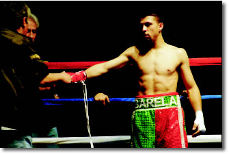Victor Barela gloves up for another fight. Barela took his opponent out in three punches.