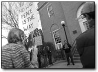 Activists opposing a war in Iraq stand outside the Old Main Post Office building on Nov. 13 to make a statement to U.S.  Scott McInnis who has an office inside./Photo by Dustin Bradford