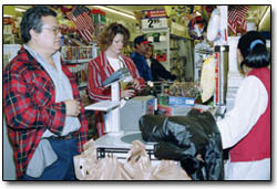 K-Mart shoppers await the damage on holiday gear.
