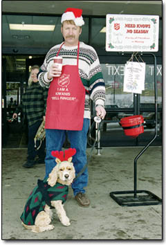 Kevin Schneider, and his faithful dog, Sam, help collect donations for the Salvation Army outside of Wal-Mart on Sunday morning.