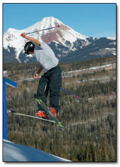 A skier tries a backwards dismount from a rail after riding on The Line.
