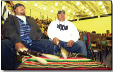 Nathan Bennett, left, and Kimo Nelson, both of Shiprock, beat on a drum.