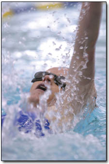 Cabrina Grubb does the backstroke during the swim competition.