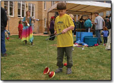 7-year-old Dylan Blair attempts to master the Diablo on the lawn of the Smiley Building Saturday afternoon.