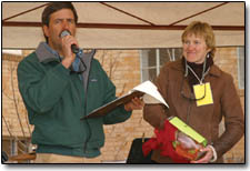 Tom Bartels works the mic and helps Lisa Bodwalk give away a few aspens trees during the Earth Day raffle.