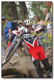 Better safe than sorry: Expert Mike West, of Boulder, makes a mad dash through the most crash-prone section of the course.  His strategy paid off with a third place finish.