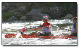 Racers battle a recent hatch of caddis flies along the Animas River during the 14-mile paddle.