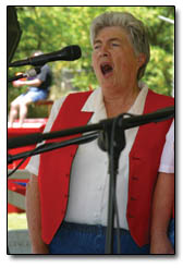 Shirley Scott, of Durango, sings during the Women's Perogative's rendition of "America."