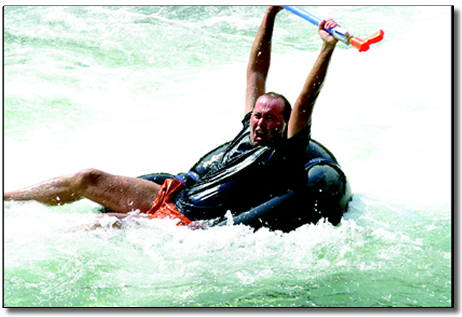 ExtremeTubing: Robert Chapman celebrates a successful run through Smelter Rapid on Monday afternoon.  