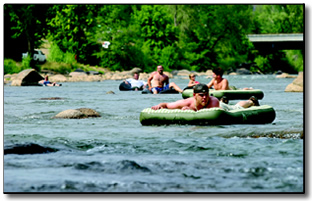 Built for comfort: Air mattresses provide the perfect flotation for a pair of river runners Monday afternoon.  