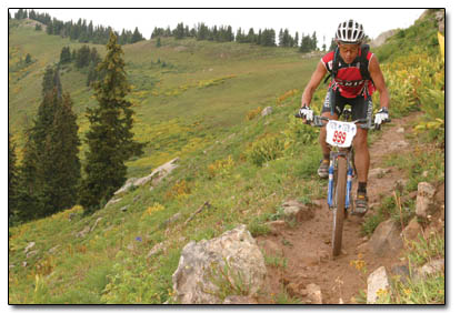 Katherine Zambrana, of Steamboat, navigates the slippery singletrack near Engineer Mountain on her way to completign the first lap and winning the women's division.