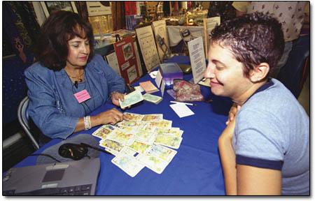 Clarissa Eads gasps at her good fortune (no reaper card) during the WholeExpo last weekend.