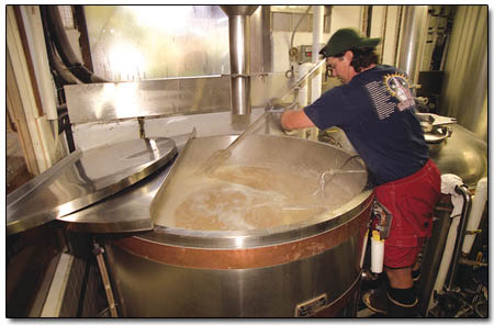 Carvers brewmaster Erik Maxson stirs up what’s going to be a raucous Friday night at the Carver brew room on Monday.