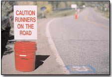 A mile marker near the bridge on Trimble Lane cautions passing motorists of the day's events.