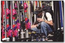 Jason Hooten browses the Ski Barn's selection of demo skis during Sunday's block party.