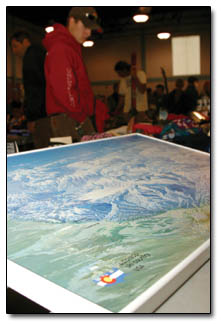 A shopper passes over a vintage Colorado Ski Country map displaying the state's ski areas and mountain ranges.