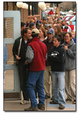 Early birds gather outside the fairgrounds exhibition hall before the swap in hopes of netting a good bargain before the masses arrive.