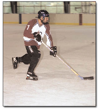 Jeremy Teber, a member of the Second Ave. Sports team, does some fancy footwork during "Stick and Puck" practice.