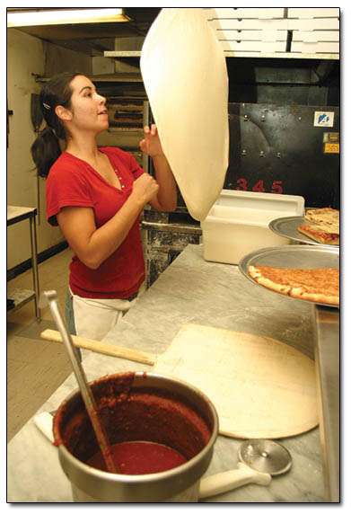 Melissa Willoughby spins a pizza at Dirorio's just after the lunch rush recently.