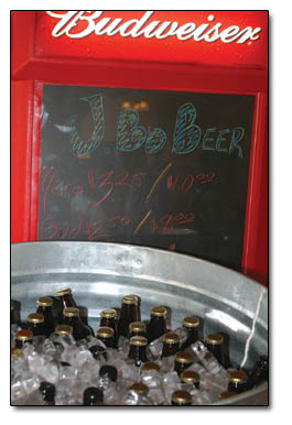A tub of ice cold beer cools at J. Bo's Pizza Monday afternoon.