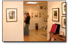 Alexi and Felicia Hubbell meander through the black and white prints on display at the Open Shutter Gallery.