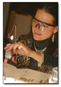 Rachelle Davis demonstrates creating hand-crafted gold and silver jewelry at the Durango Arts Center.