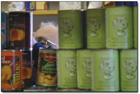Uber volunteer Scott Diamnond helps restock the shelves at the Durango Food Bank earlier this week.