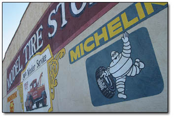 The Michelin Man waves to passersby from his perch on Main and 12th.