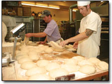 Scott Gilbert, left, and Chris Crowl work a busy Tuesday morning at Bread.