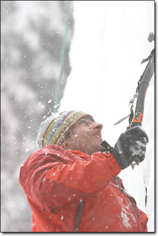 Dan Foster, of Flagstaff, grunts it out as ice shards spray from the impact of his ice axe.