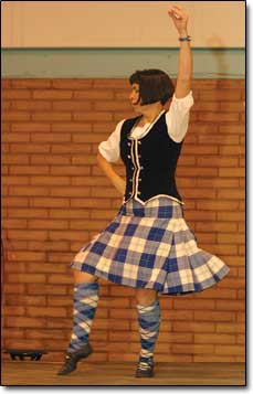Maria Blair, a member of the Scottish Country Dancers of Durango strikes a pose near the end of the group's dance routine.