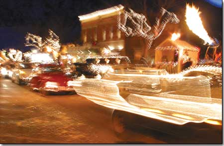 The Snowdown Light Parade gets underway with the VW Bug procession along the south end of Main Ave. on Friday night.
