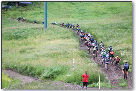 
  Riders make their way up the slippery base of Durango Mountain Resort just after the early morning start.
