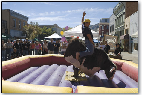 Dio Cifuni goes for the full eight seconds on the mechanical bull Saturday afternoon.