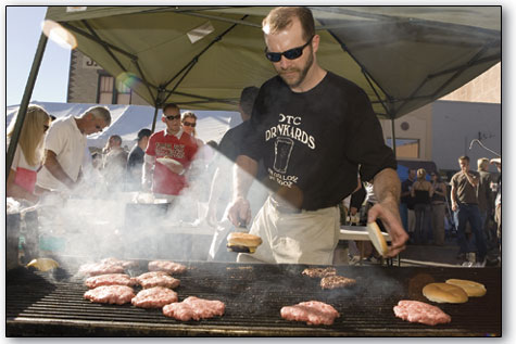 Jon Park, of Olde Tymer's, keeps a hungry, late-afternoon crowd well fed Saturday.