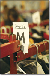 Ski apparel hangs from the racks inside the fairgrounds.