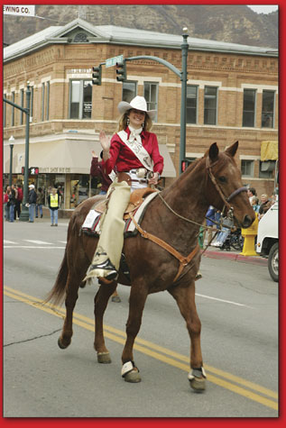 The 2005 Fiesta Days Queen enjoys a trip down Main Avenue from atop her trusty companion.