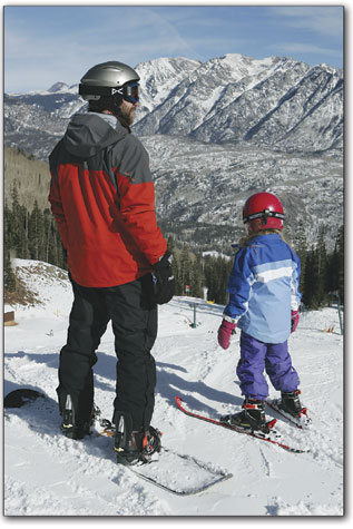 Ned Daley and 6-year-old Ryann take in the view before heading down for another run. 