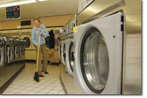 College Plaza Laundromat owner Lynn Urban gets ready to do a
little cleaning Monday.