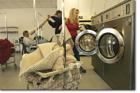 June Hall, owner of Florida Laundry, keeps things running
smoothly after a busy weekend.