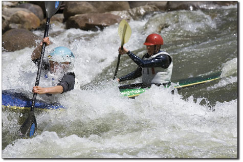 Cully Brown passes Kier Samuelson in Smelter Rapid, securing his
second place finish in the junior mens class on Sunday morning on
the Animas River.