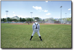 A player for the Durango nine stands in left field, ready for
play.