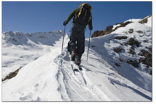 Spencer traverses a ridge high in the San Juans on an already
thinning snowpack.