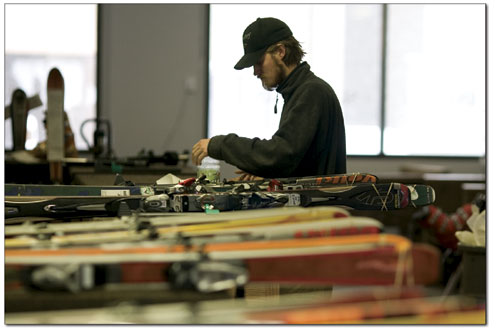 Kelly Hill looks over this seasons crop of rental skis in
preparation for the crowds.